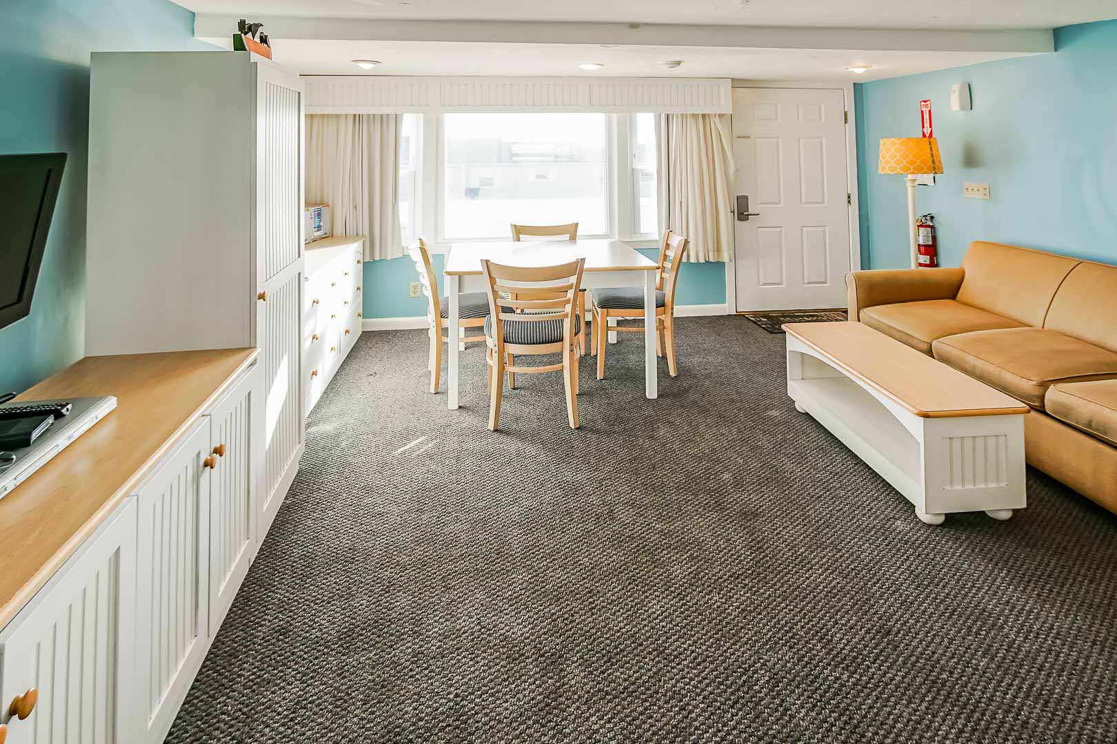 A standard dining and living room area at VRI's Seawinds II Resort in Massachusetts.